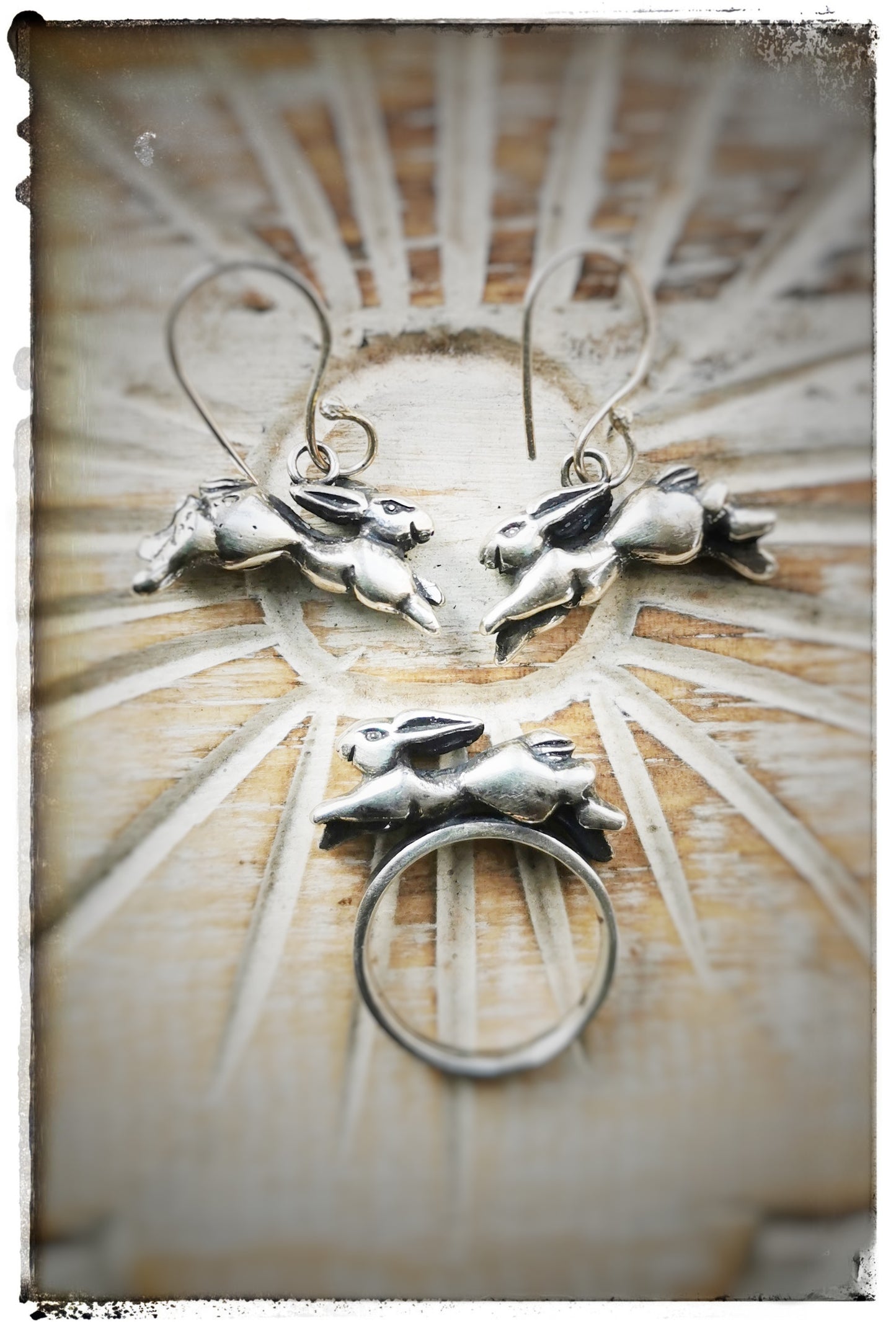 Silver running hare earrings with looped earwires