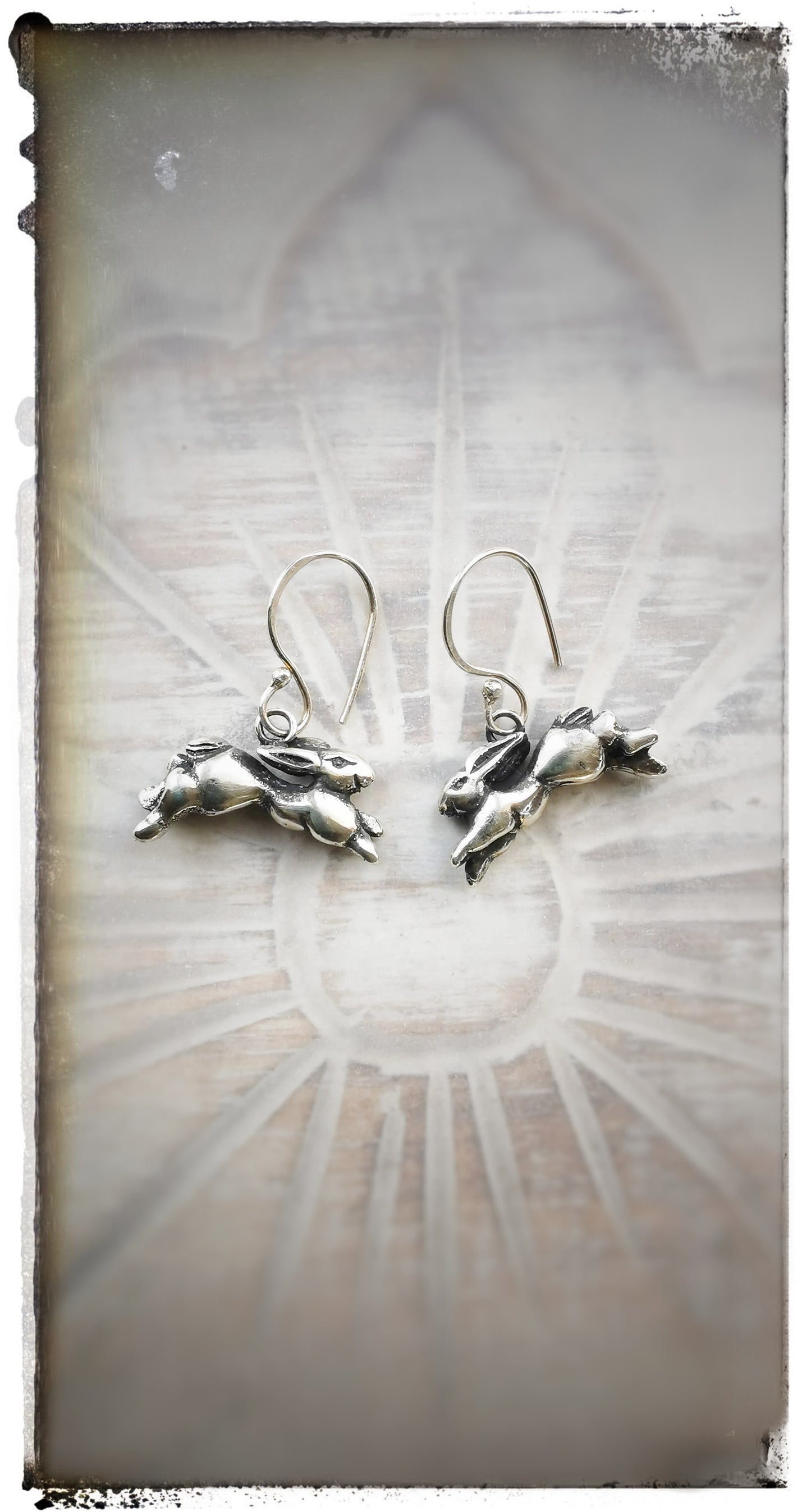 Silver running hare earrings with looped earwires