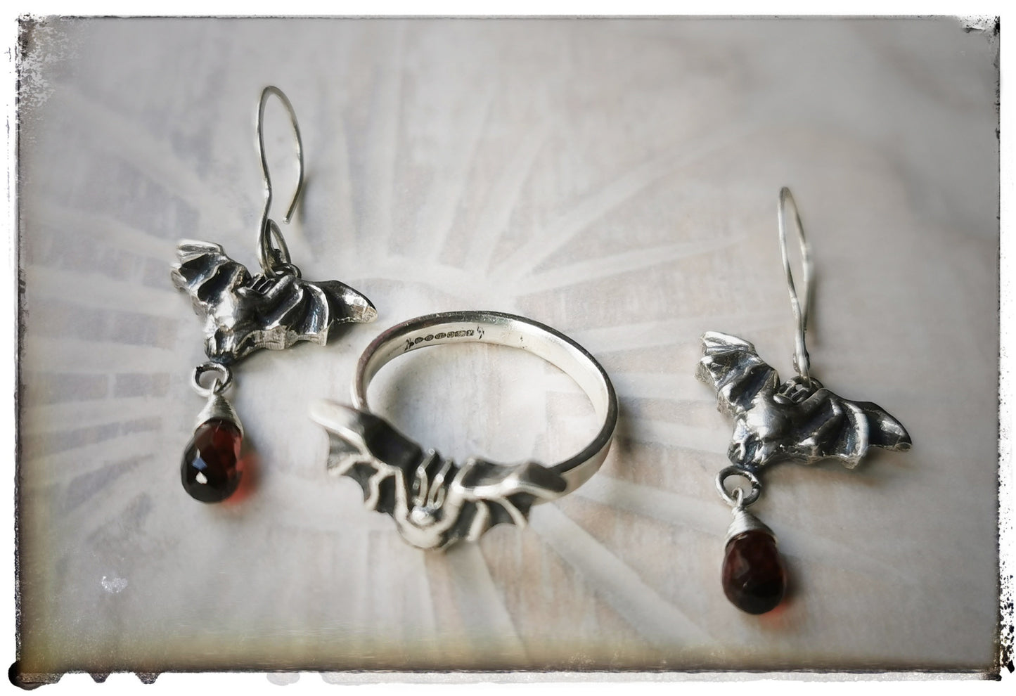 Bat earrings with Garnet drops