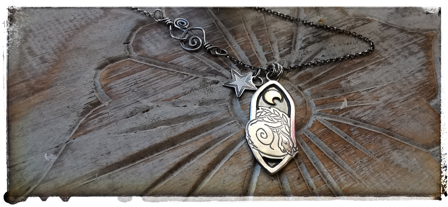 Silver and gold badger pendant