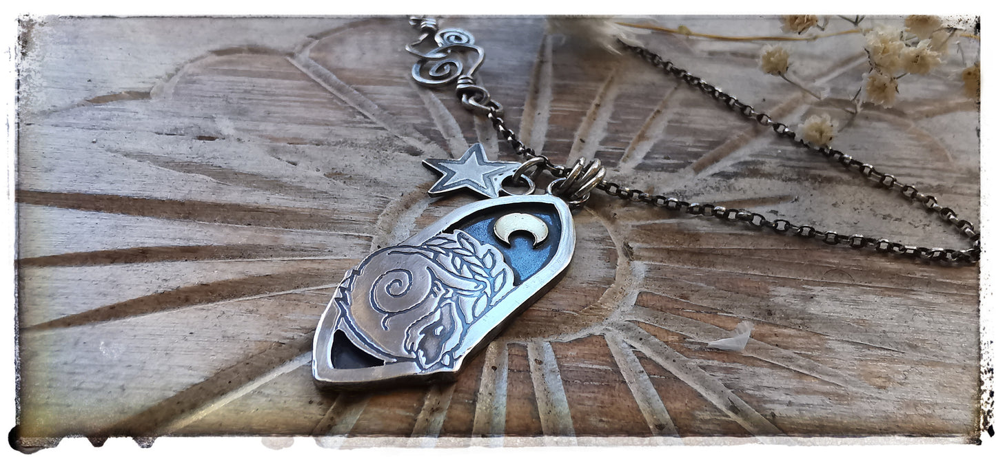 Silver and gold badger pendant