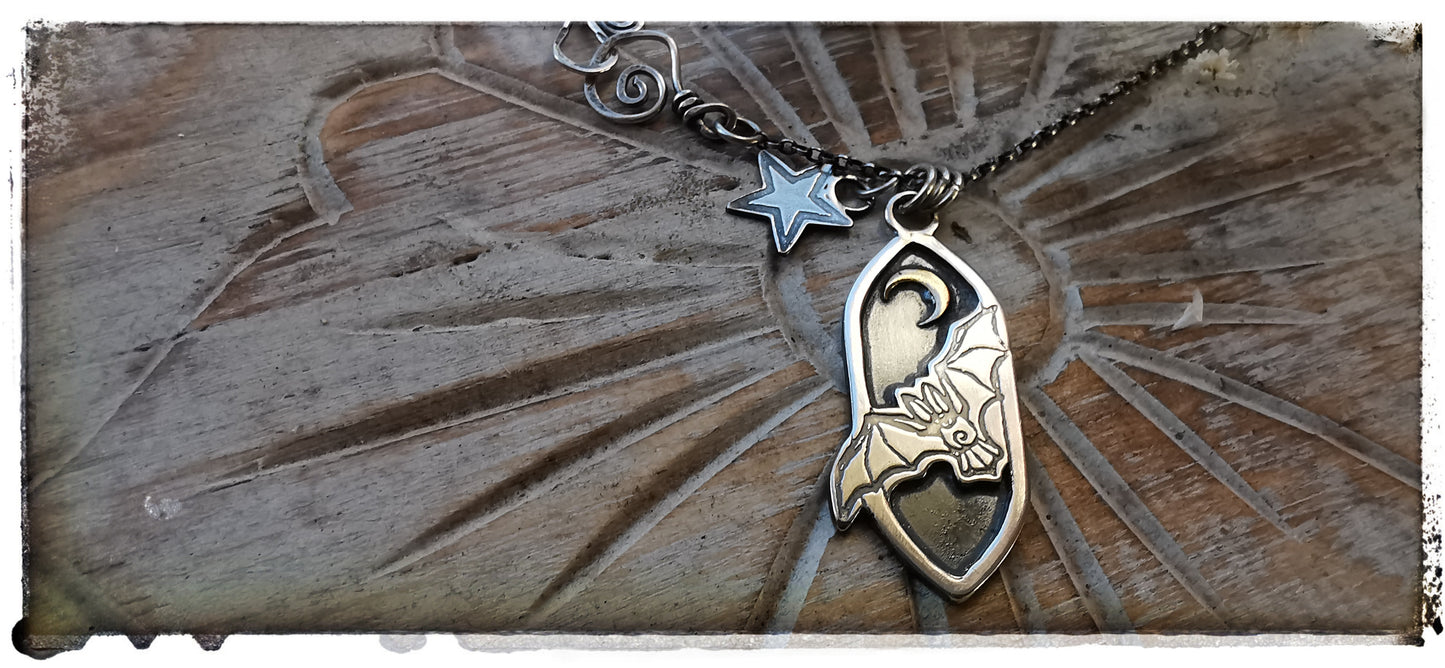 Silver and gold bat pendant