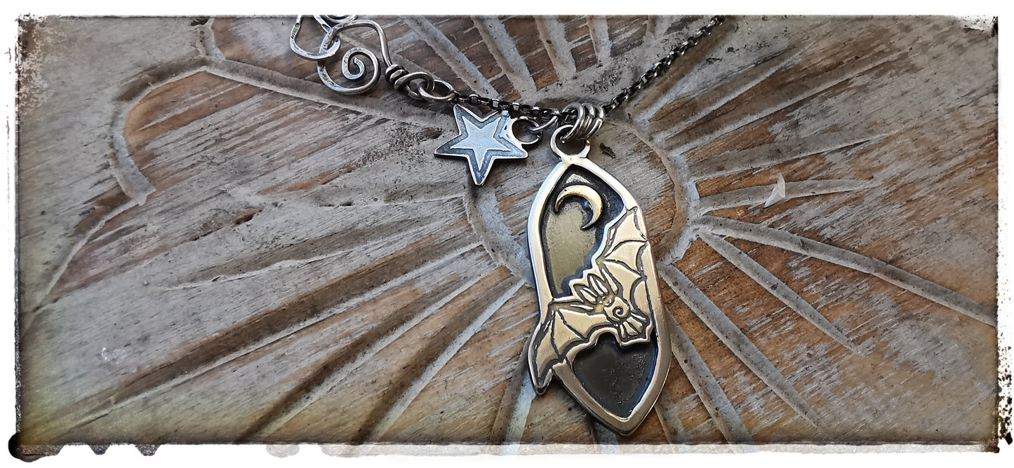 Silver and gold bat pendant