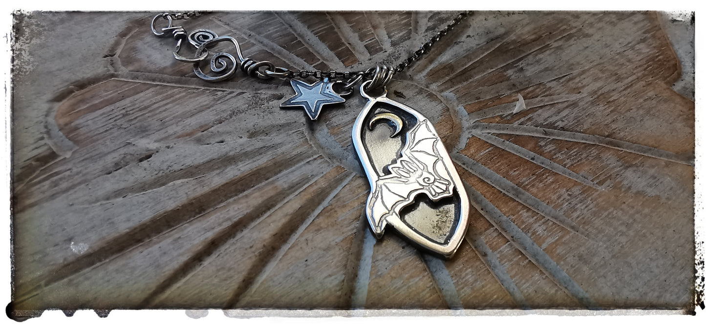 Silver and gold bat pendant