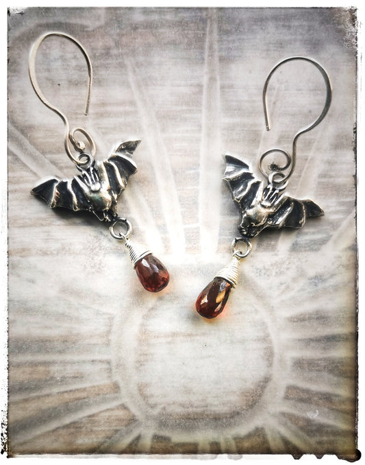 Bat earrings with Garnet drops