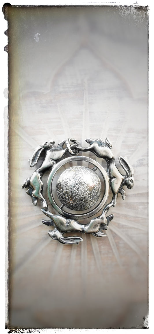 'Moonchasers' triple hare pendant with rotating moon.